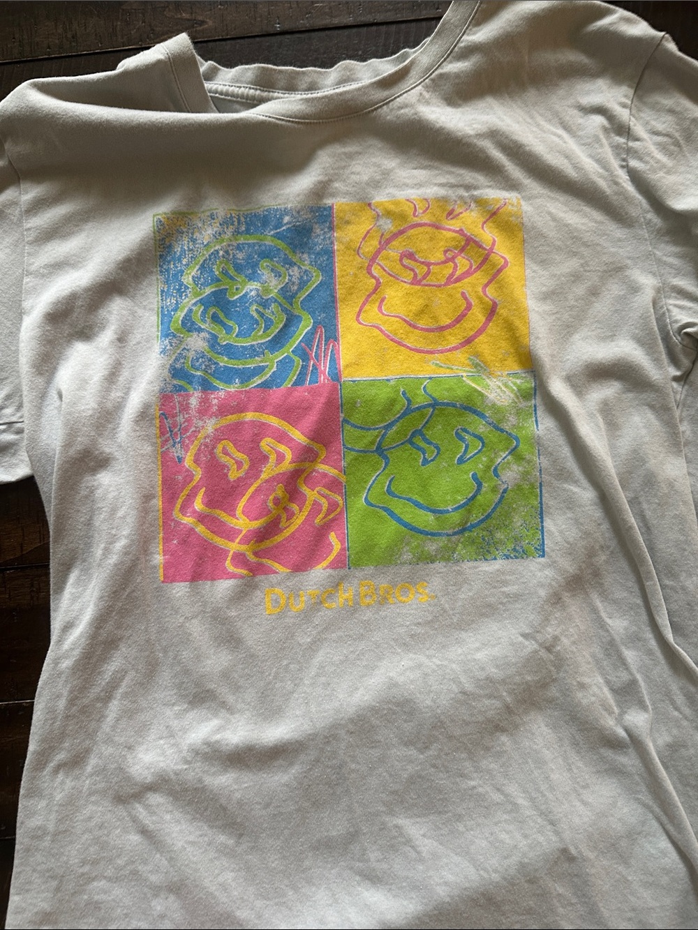Dutch Bros White Tee with Blue, Yellow, Pink & Green Smile Panels